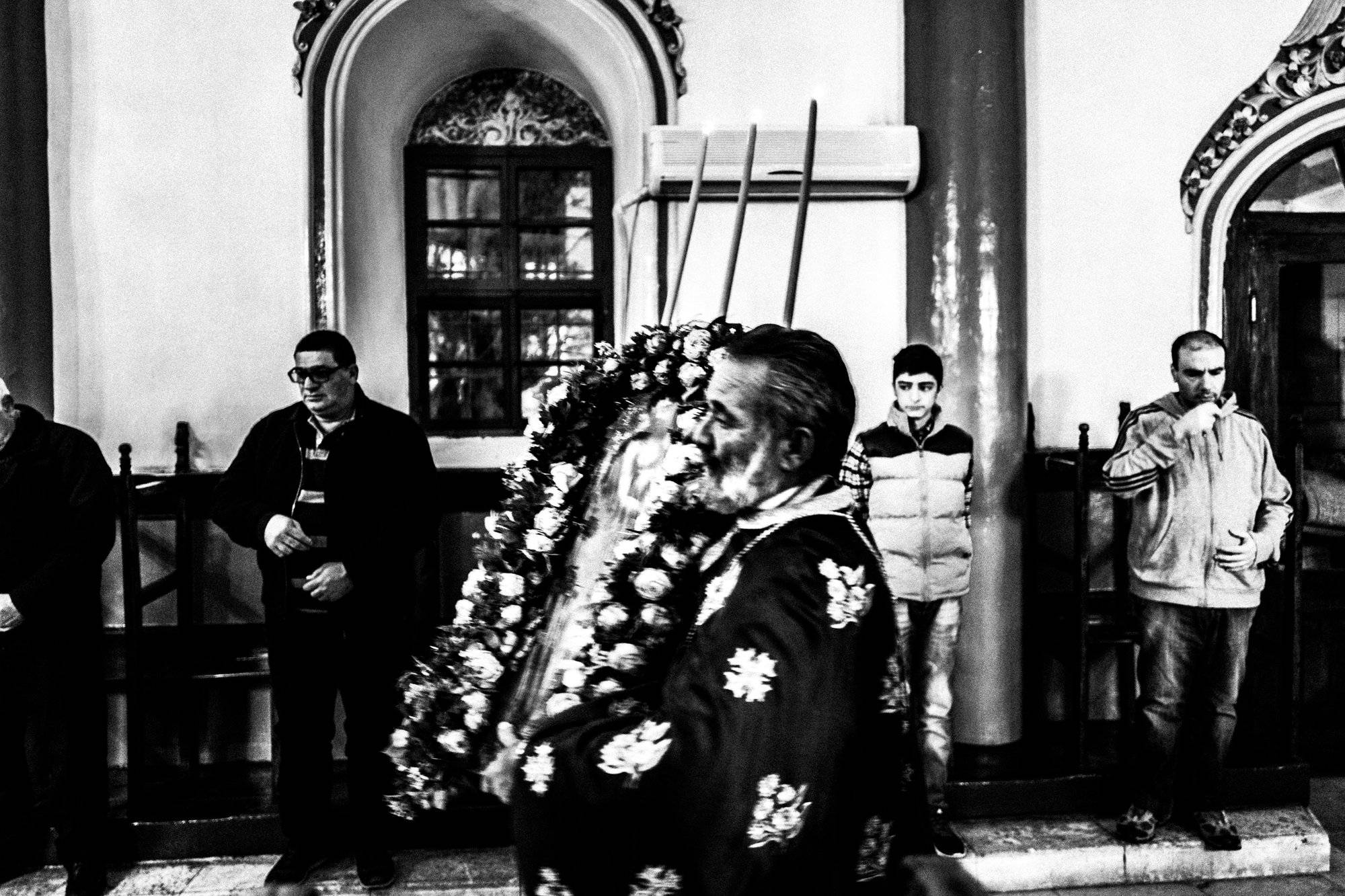 The priest conducting the Holy Wednesday service in Kastellorizo.