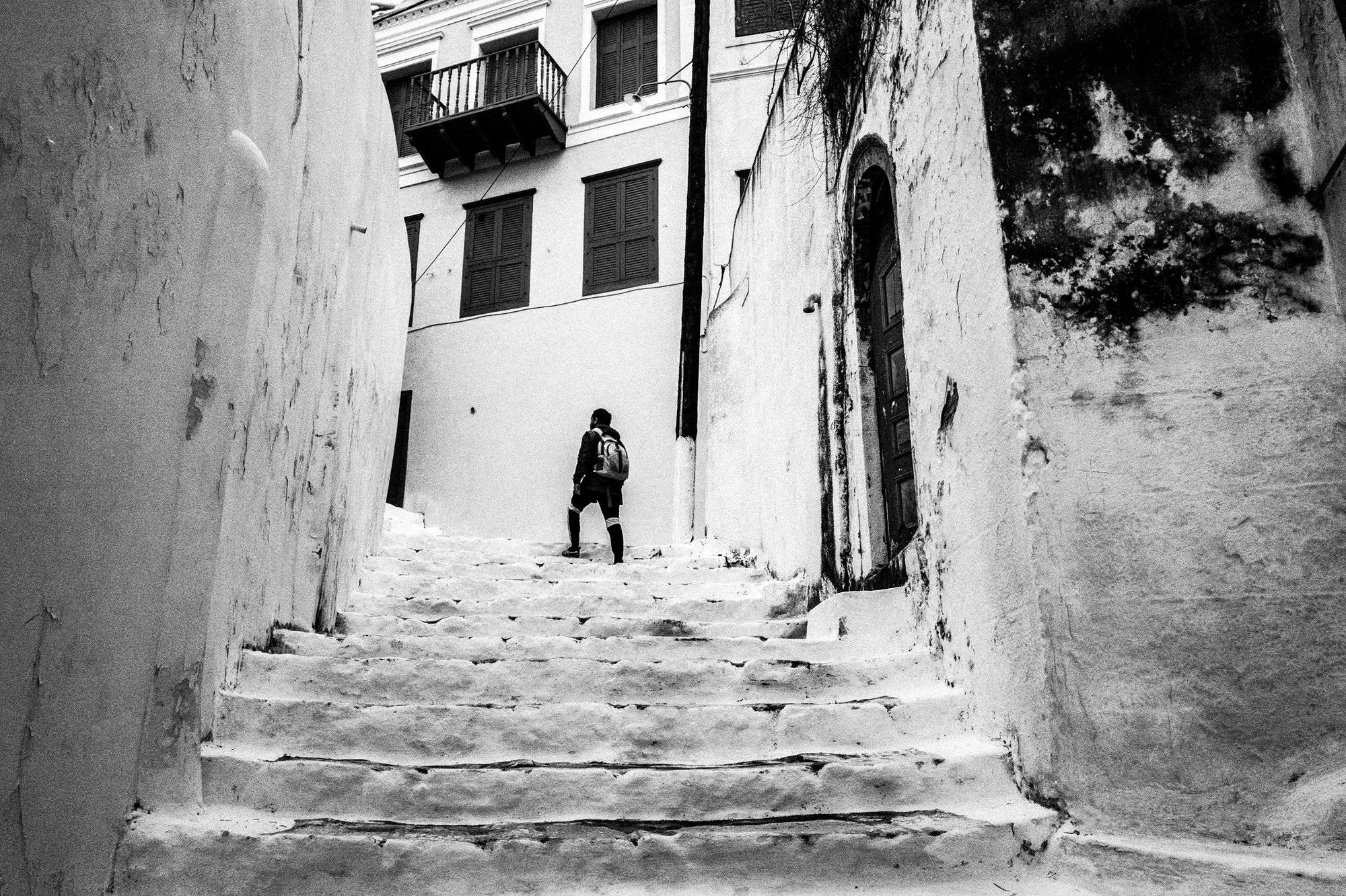 A child walking through a street of Kastellorizo on Easter Sunday.