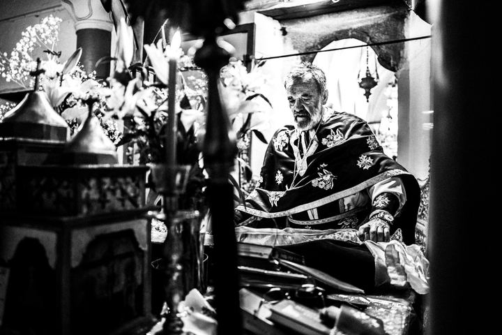 The priest inside the church after the return of the Epitaph.