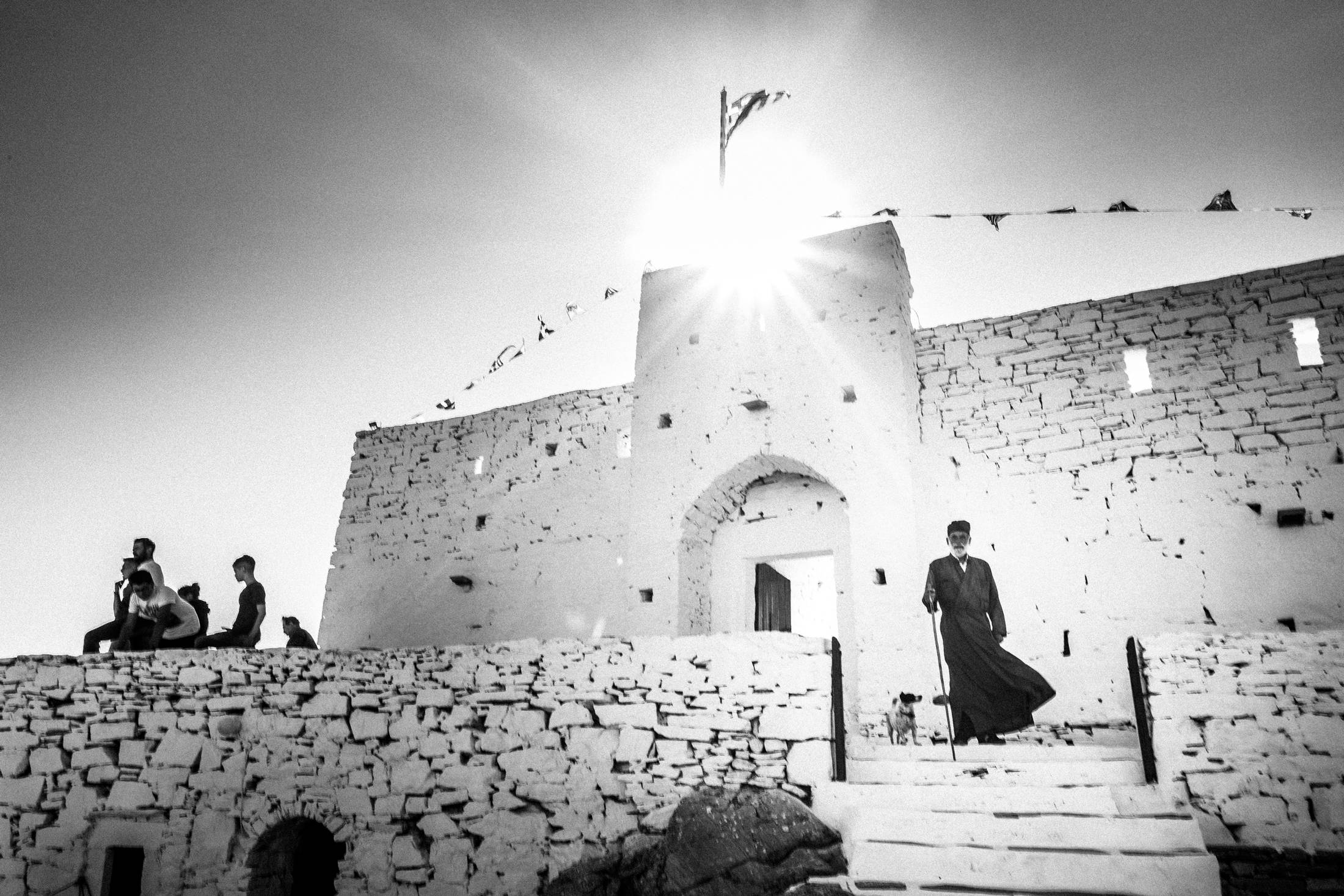 The priest arriving at the Prophet Elias monastery on Sifnos.