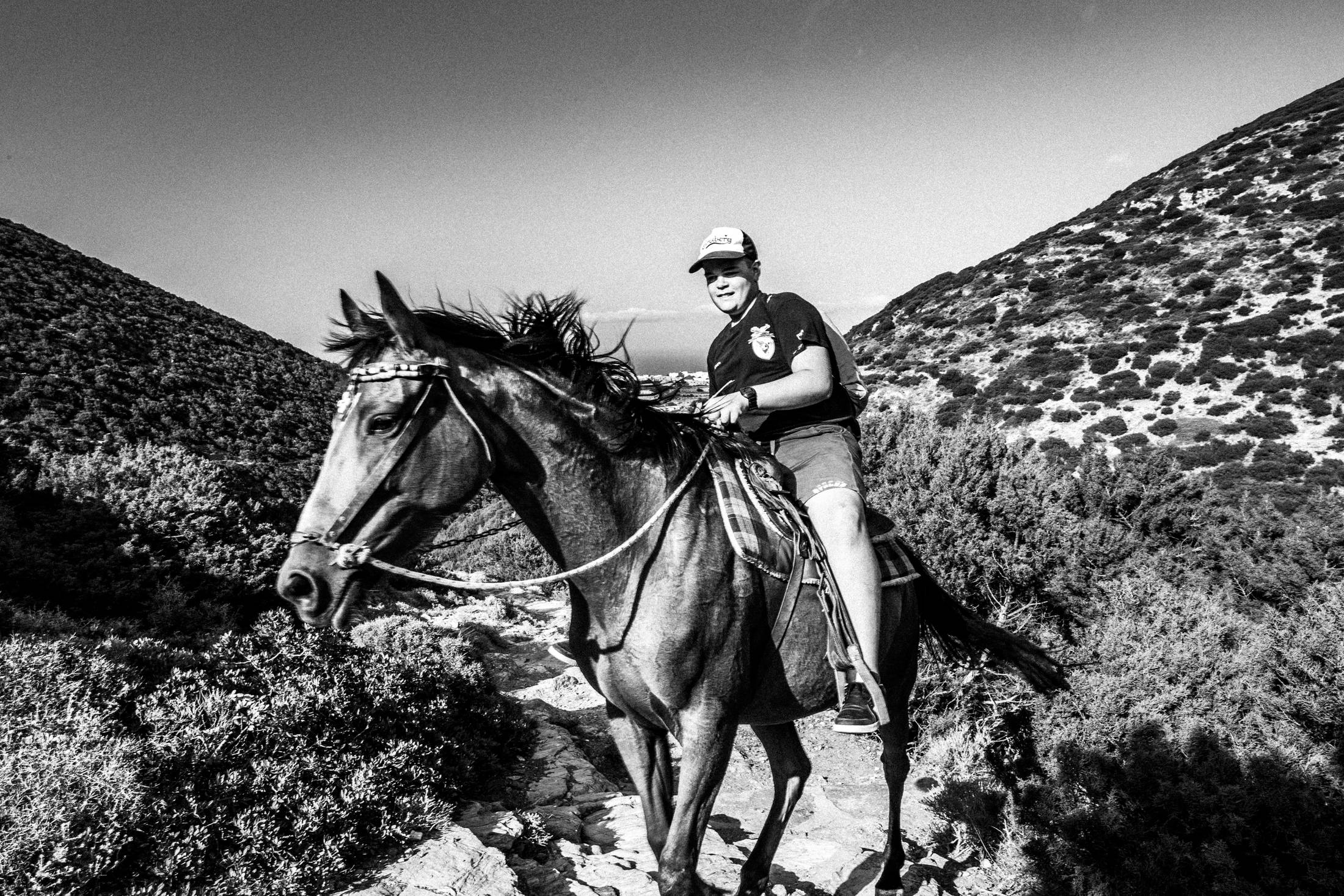 A rider ascending the mountain toward the Prophet Elias monastery.