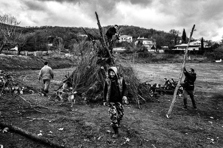 Gathering wood to light up the bonfire at Sotira for Christmas, near Florina, Macedonia