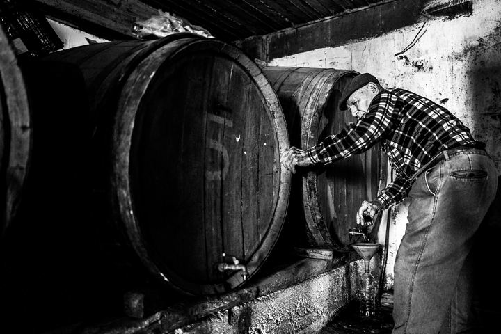 Wine barrels inside a traditional Santorini canava.
