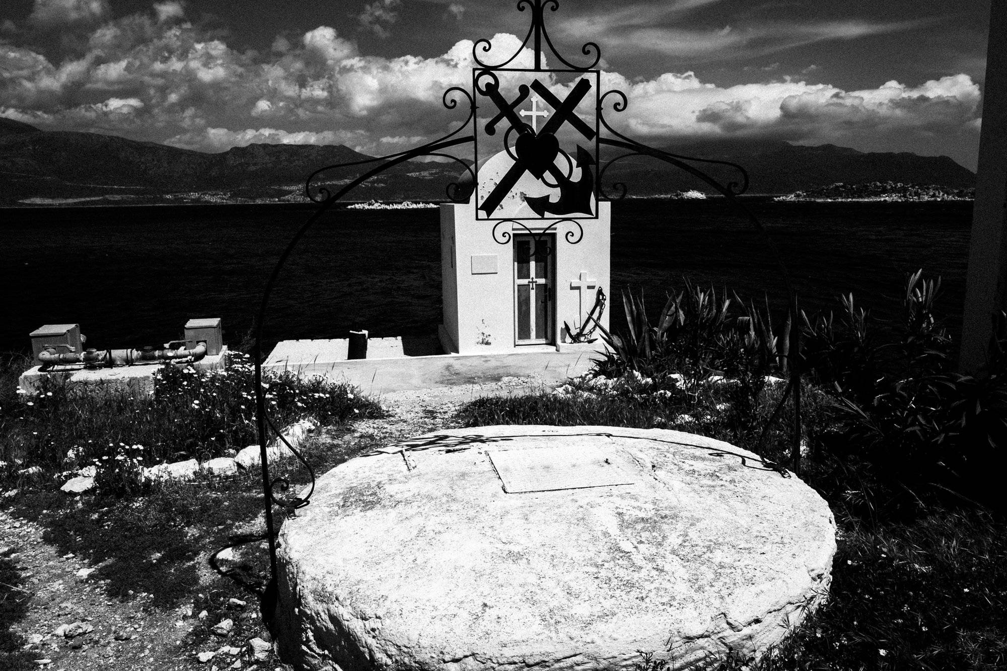 Black and white photograph of a small chapel in Mandraki, Kastellorizo.