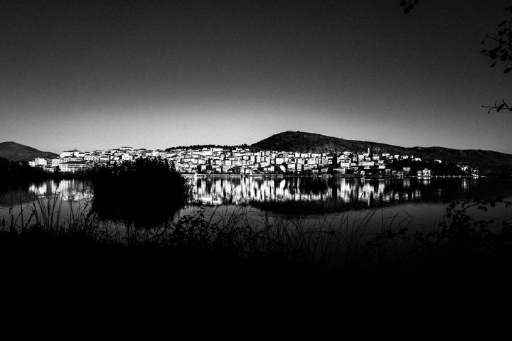 Black and white winter photograph from Kastoria, with lake light and a quiet northern Greek atmosphere.