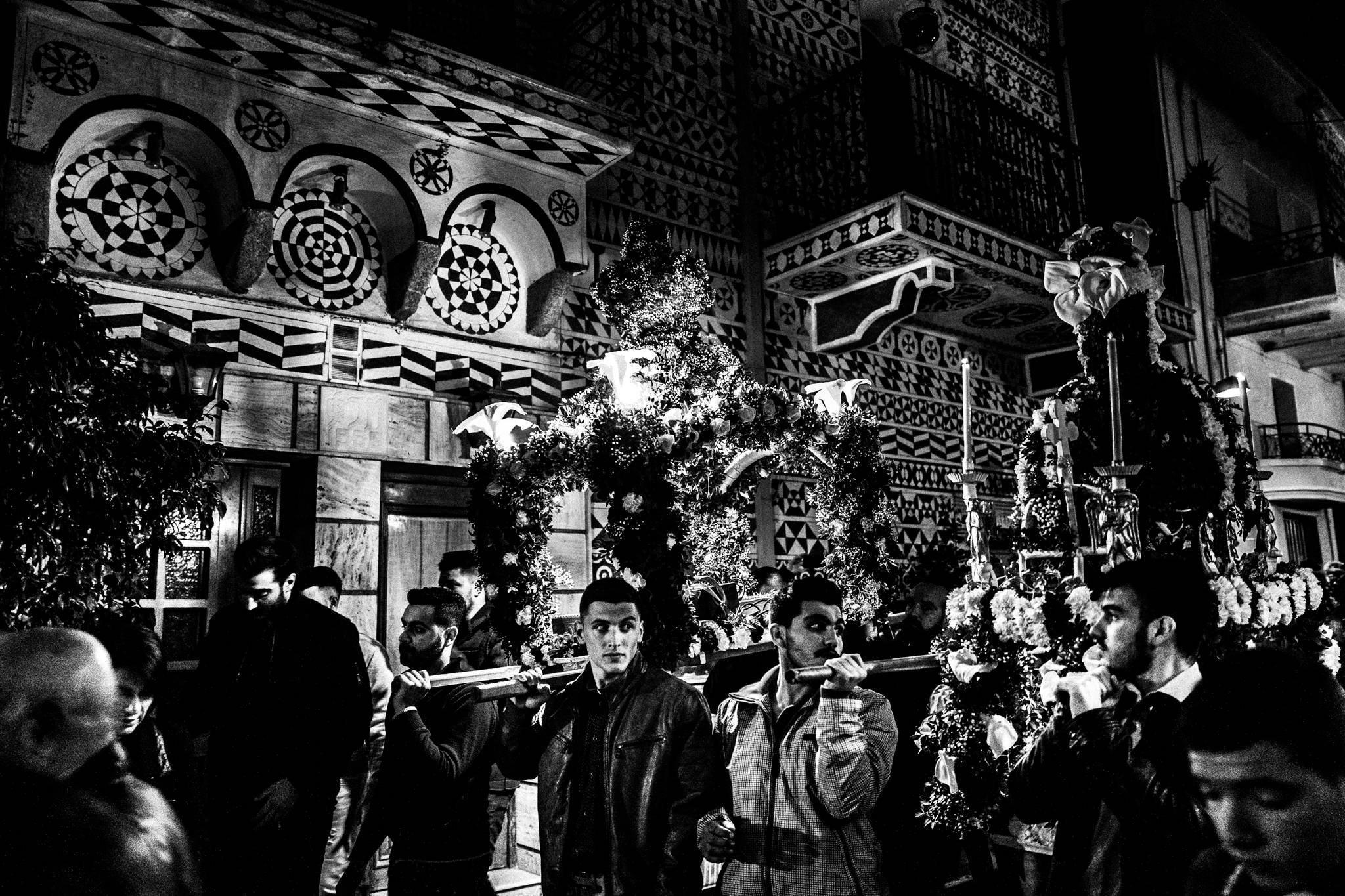 The Epitaph procession framed by the decorated buildings of Pyrgi.