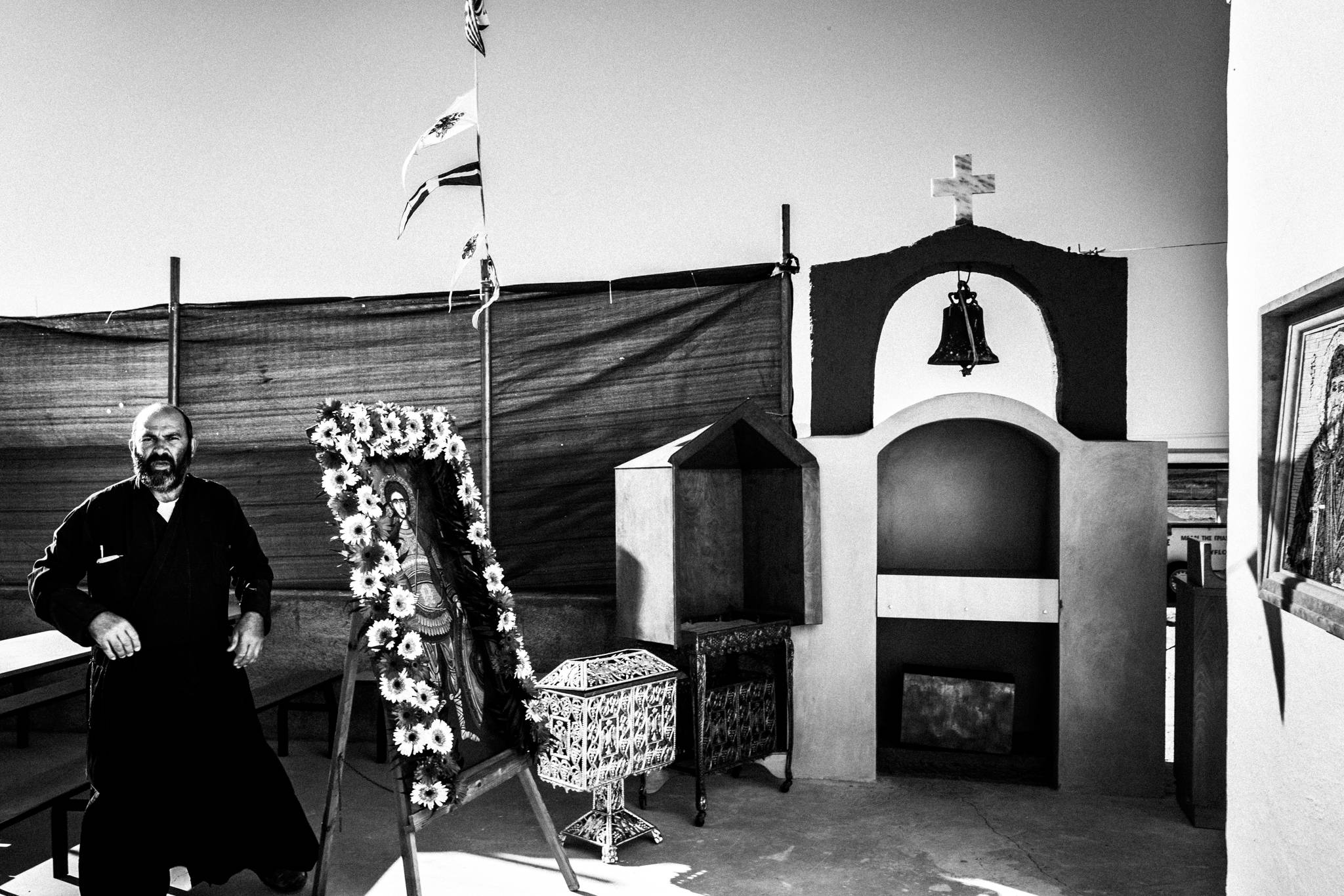 The priest preparing the icon of Saint Fanourios at the church outside Mastichari, Kos.