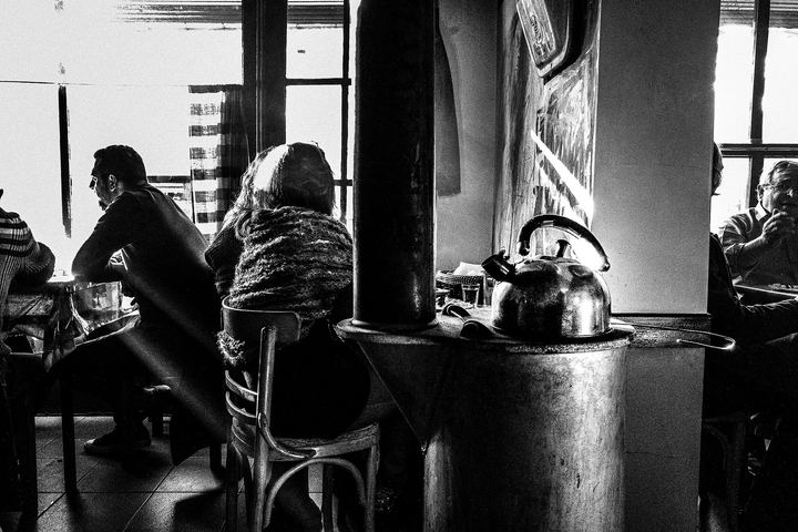 Black and white photograph of a kettle used by musicians collecting money during a café performance in Florina.