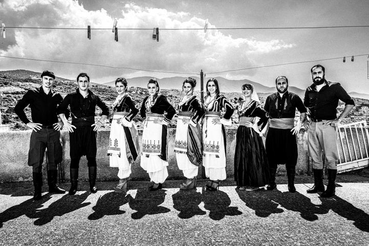 Black and white photograph of family members before a traditional wedding in Anogia, Crete.