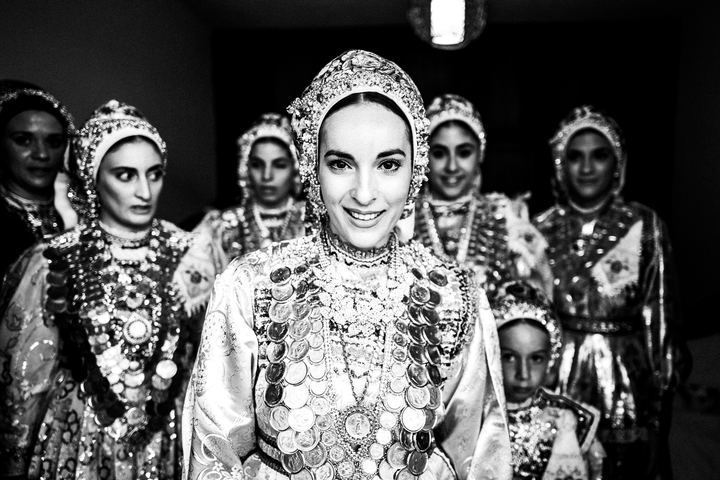 Black and white photograph of a bride in traditional dress during a wedding in Olympos, Karpathos.