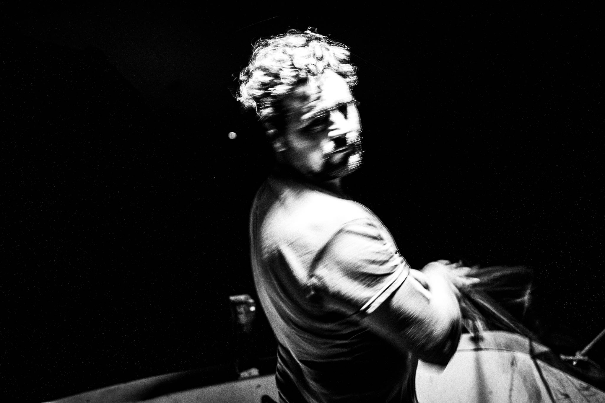 Black and white photograph of Pavlos laying fishing nets at night near Diafani, Karpathos.