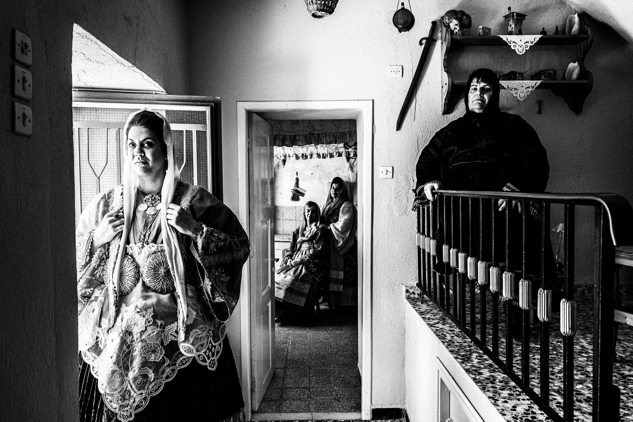 Women wearing the local dressed of Trikeri in Magnesia, inside a traditional local house.