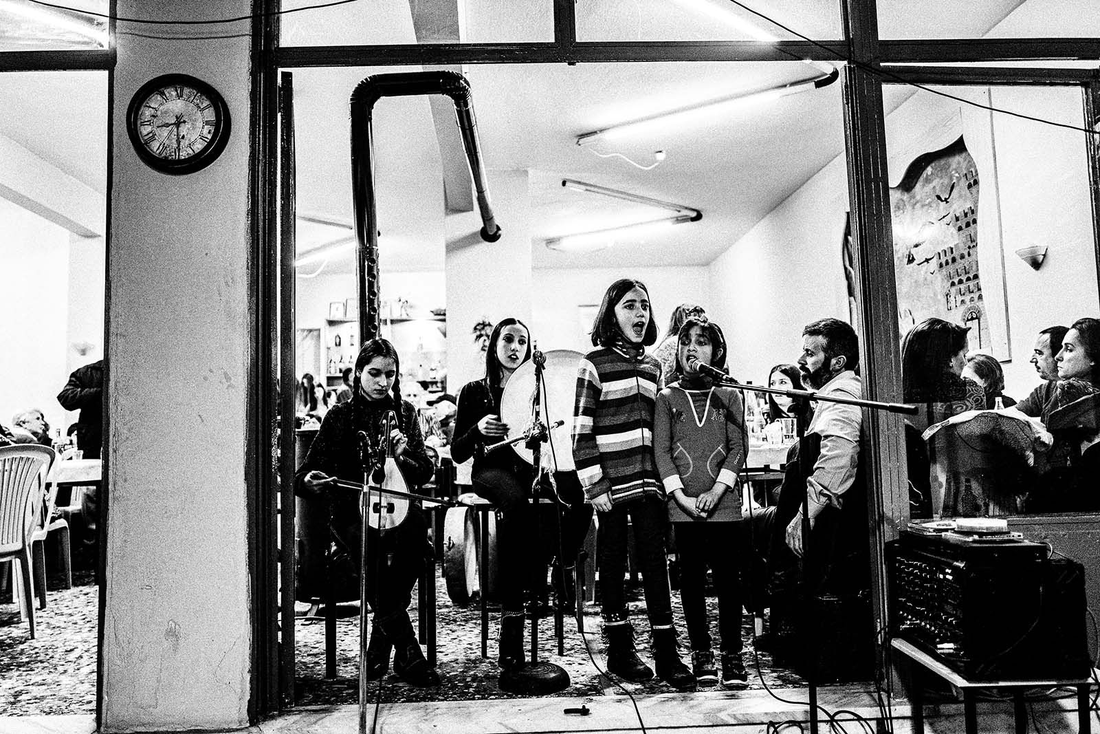 Night celebration at the village of Pyrgi in Drama - Kids singing with orchestra